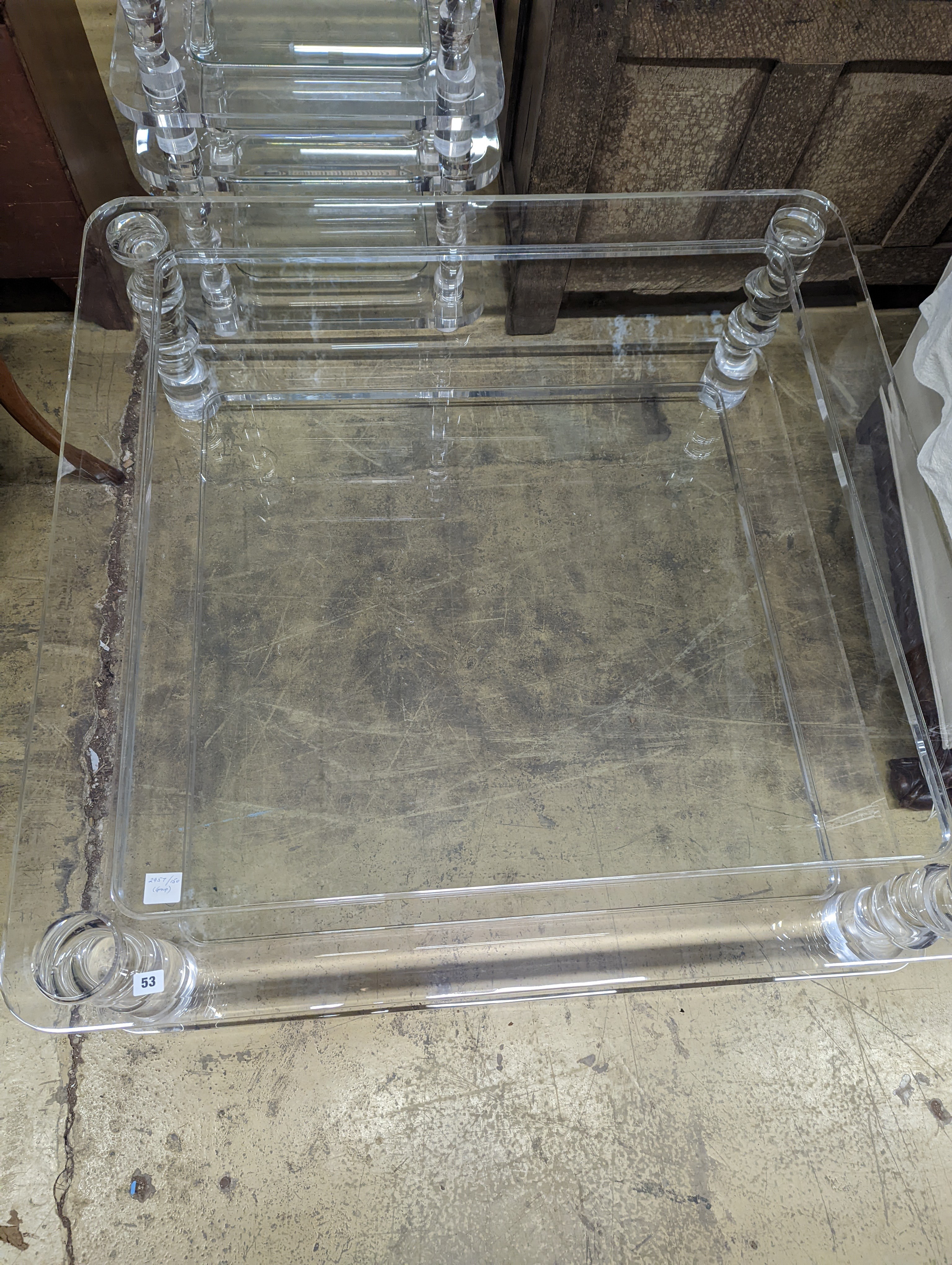 A contemporary square perspex and glass two tier coffee table, length 120cm, depth 40cm